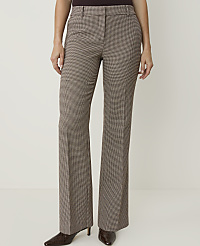 A person stands in front of a plain white background, wearing brown checkered flared pants and dark pointed-toe heels. carousel Product Image 2