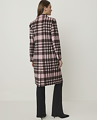 A woman in a pink and brown plaid coat stands against a plain, light-colored background. carousel Product Image 2