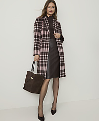 A woman in a plaid coat and leather skirt stands against a plain background, holding a brown suede tote bag. carousel Product Image 3