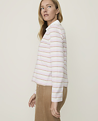 A woman in a striped shirt and corduroy skirt stands against a plain, light background. carousel Product Image 2