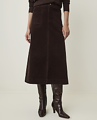 A person stands in a brown corduroy skirt and croc-embossed boots against a plain, light-colored background. carousel Product Image 2