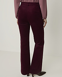 A person wearing burgundy corduroy flared pants and a mauve blouse stands against a plain white background. carousel Product Image 3