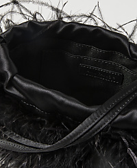 A black satin drawstring pouch bag adorned with black feathers in the foreground is set against a plain white background. carousel Product Image 2