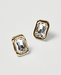 Two rectangular, gold-framed earrings with clear, faceted gemstones are displayed against a plain, light gray background. carousel Product Image 1