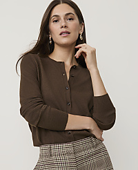 A woman in a brown cardigan and plaid pants poses against a plain background. carousel Product Image 1