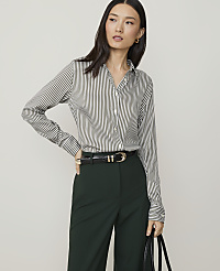 A woman in a striped shirt and brown suede skirt stands against a plain white background. carousel Product Image 1