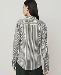 A woman in a striped shirt and brown skirt stands against a plain white background. carousel Product Image 2