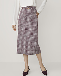 A woman in a white blouse and a plaid pencil skirt with a belt stands against a plain white background. carousel Product Image 2