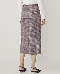 A person wearing a plaid skirt and heels stands against a plain white background. carousel Product Image 3