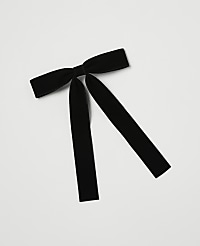 A black velvet bow with long, trailing ribbons lies on a plain white background. carousel Product Image 1