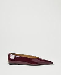 A glossy burgundy pointed-toe flat shoe rests on a plain white background. carousel Product Image 1
