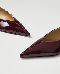 Two glossy burgundy pointed-toe flats rest on a plain white background. carousel Product Image 2