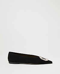A black suede flat shoe with a jeweled buckle sits on a plain white background. carousel Product Image 2