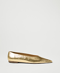 A metallic gold pointed-toe flat shoe rests on a plain white background. carousel Product Image 1
