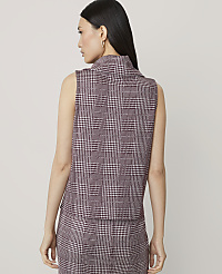 A woman in a plaid vest and skirt stands against a plain background. carousel Product Image 2