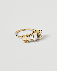 A gold ring with baguette-cut clear stones is displayed on a plain white background. carousel Product Image 1