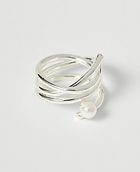 A silver coiled ring with a pearl accent rests on a plain white background. carousel Product Image 1
