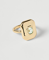 A gold ring with a rectangular face and a light green gemstone sits on a plain white background. carousel Product Image 1