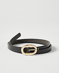 A black leather belt with a gold oval buckle lies on a plain white background. carousel Product Image 1