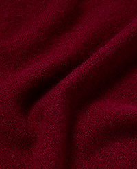 Deep red fabric with soft folds and subtle texture fills the frame, with shadows creating depth in the background. carousel Product Image 2