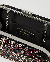 A black beaded clutch with a floral design in the foreground is open to reveal a black interior with an Ann Taylor label in the background. carousel Product Image 2