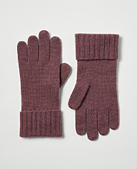 A pair of rose-colored knit gloves with ribbed cuffs rests on a plain, light gray background. carousel Product Image 1