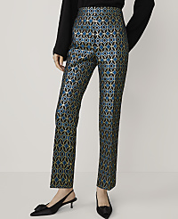 A person stands in the foreground wearing teal and gold patterned pants and black kitten heels, against a plain white background. carousel Product Image 2