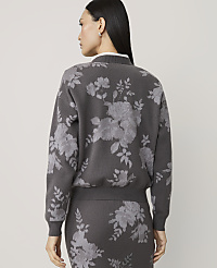 A woman in a gray floral-patterned sweater and skirt stands against a plain gray background. carousel Product Image 2