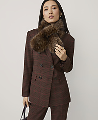 A woman in a brown plaid suit and fur collar stands against a plain gray background. carousel Product Image 1
