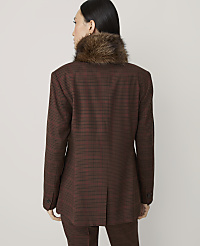 A woman in a brown plaid blazer with a fur collar stands against a plain, light gray background. carousel Product Image 2