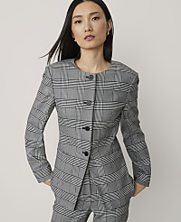 A woman in a plaid suit stands against a plain white background. carousel Product Image 1