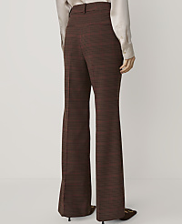 A person in flared, plaid trousers stands against a plain, light background. carousel Product Image 3