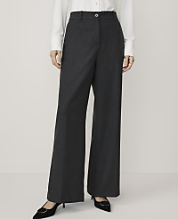 A person in a white shirt and dark grey wide-leg trousers stands against a plain white background. carousel Product Image 2
