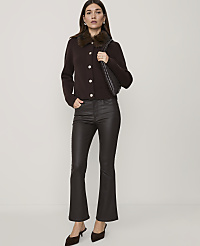 A woman in a brown cardigan and faux leather pants stands against a plain white background. carousel Product Image 1