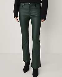A person stands in dark green flared pants and black boots against a plain, light-colored background. carousel Product Image 2