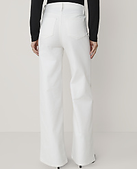 A person wearing white wide-leg jeans stands against a plain white background. carousel Product Image 3
