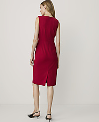 A woman in a red dress stands against a plain, light-colored background. carousel Product Image 2
