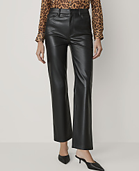 A person wearing black faux leather pants and a leopard print blouse stands against a plain white background. carousel Product Image 2