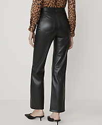 A person wearing black faux leather pants and a leopard print blouse stands against a plain, light-colored background. carousel Product Image 3