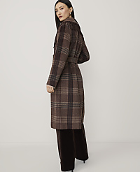A woman in a brown plaid coat and dark pants stands against a plain, light background. carousel Product Image 2