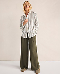 A woman in a striped shirt and wide-leg olive pants stands against a plain, light-colored background. carousel Product Image 5