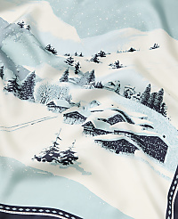 Snow-covered houses and pine trees sit in the foreground of a winter landscape with rolling white hills and a light blue sky in the background. carousel Product Image 2