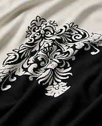 A black and white ornate damask pattern is woven into a draped fabric. carousel Product Image 2