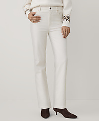 A person wearing a white sweater and white trousers with brown boots stands against a plain white background. carousel Product Image 2