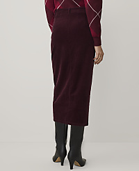 A person wearing a burgundy corduroy skirt, a matching patterned sweater, and black boots stands against a plain white background. carousel Product Image 3