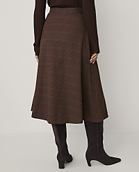 A person wears a brown ribbed top, a brown plaid A-line skirt, and dark brown boots against a plain light gray background. carousel Product Image 3