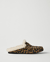 A leopard-print loafer with a cream-colored faux-fur lining sits against a plain, light gray background. carousel Product Image 1