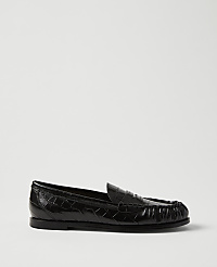 A single black crocodile-embossed leather loafer sits in the foreground against a plain, light grey background. carousel Product Image 1