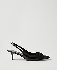 A single black patent leather slingback heel with a bow detail sits against a plain, light gray background. carousel Product Image 1