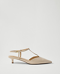 A single beige patent leather kitten heel with an ankle strap sits against a plain, light grey background. carousel Product Image 1